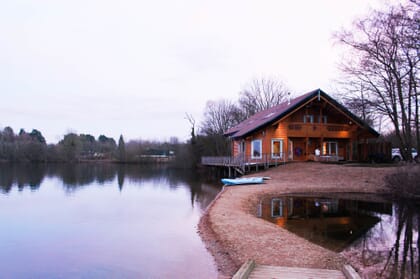 Moondara log cabin at Log House Holidays at sunset
