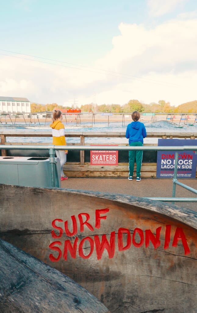 Kids watching surfing at Adventure Parc Snowdonia Kids watching surfing at Adventure Parc Snowdonia