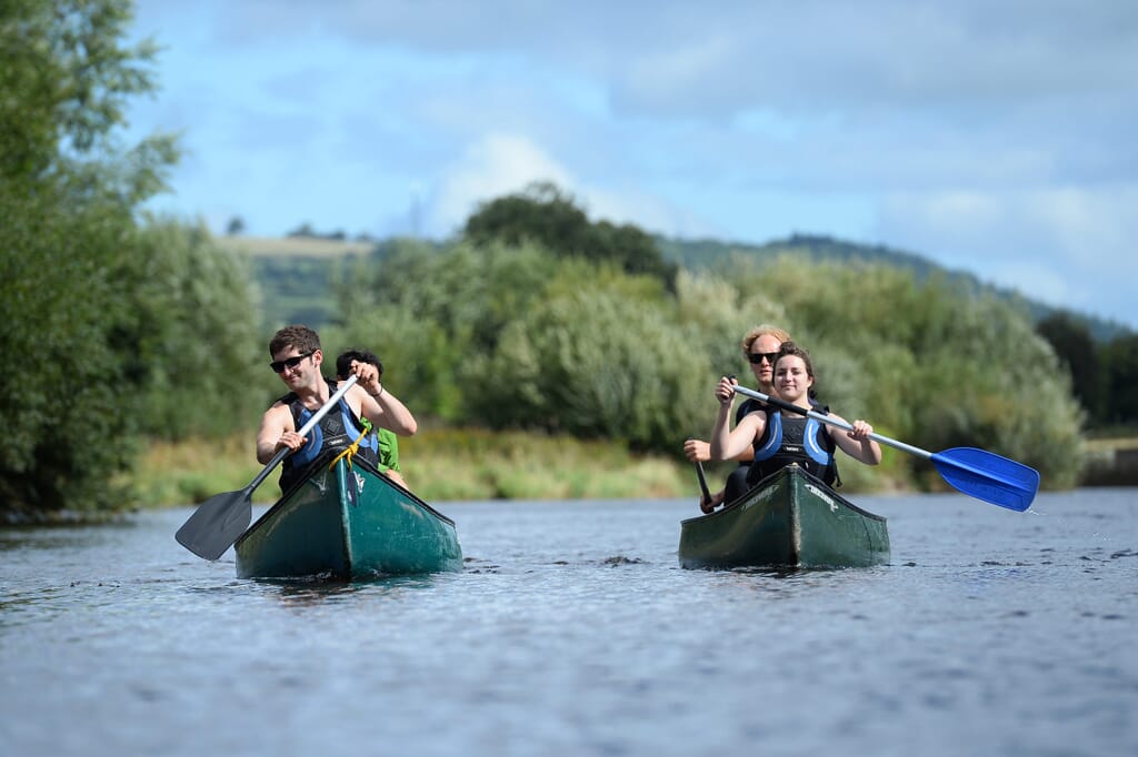 people canoeing down the river wye people canoeing down the river wye
