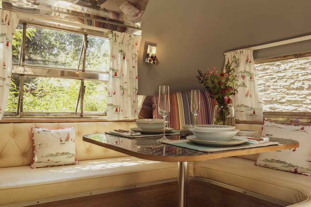 Dixie airstream retro van near lake windermere - dining table inside Dixie airstream retro van near lake windermere - dining table inside