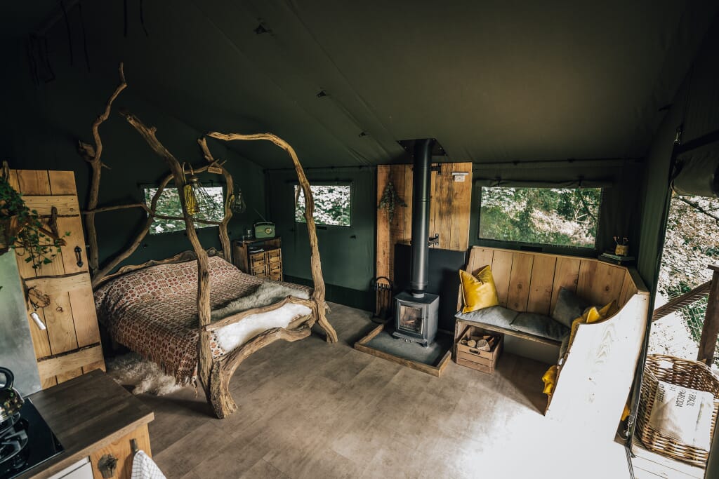 By The Wye - glamping site wye valley safari tent inside living space and log burner