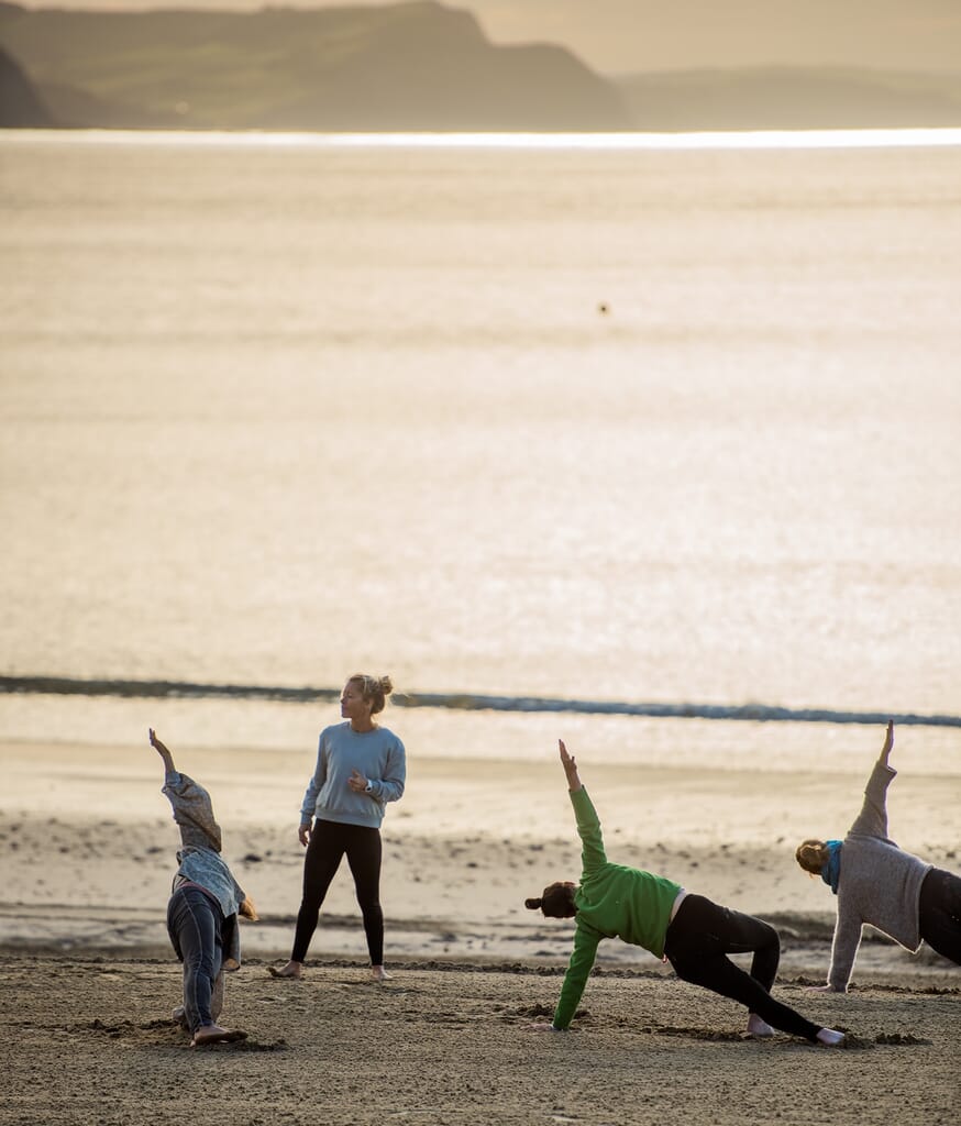 yoga with pip from Maitri Yoga on Lyme Regis beach
