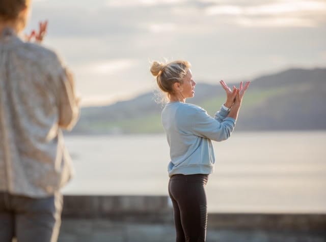 yoga with pip from Maitri Yoga on Lyme Regis beach