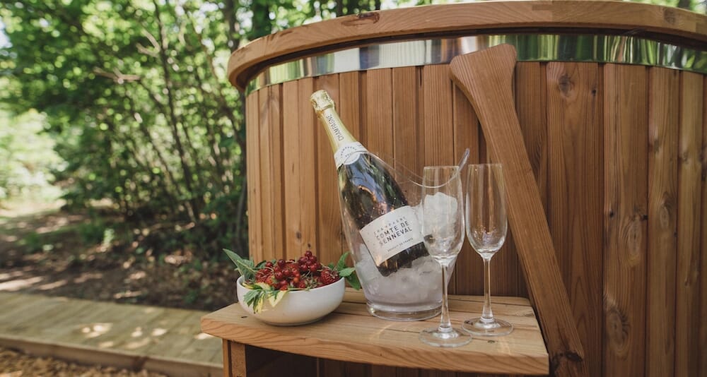 glamping sussex- the roundhouse fizz by the hot tub