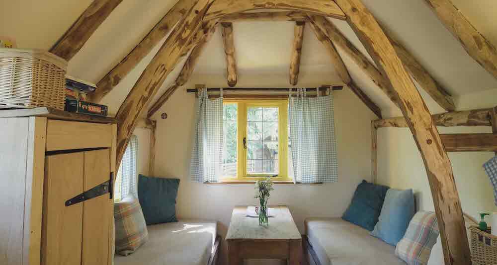 Woodcutters Cottage glamping cabin in Rye - seating area
