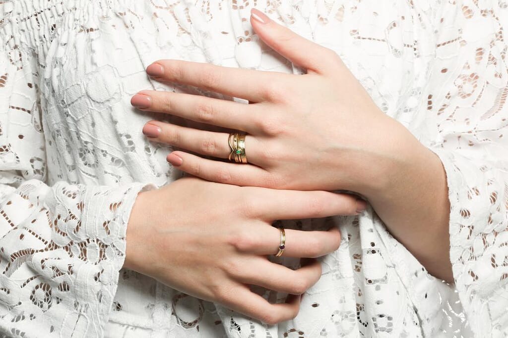 model wearing wedding ringscouple making rings