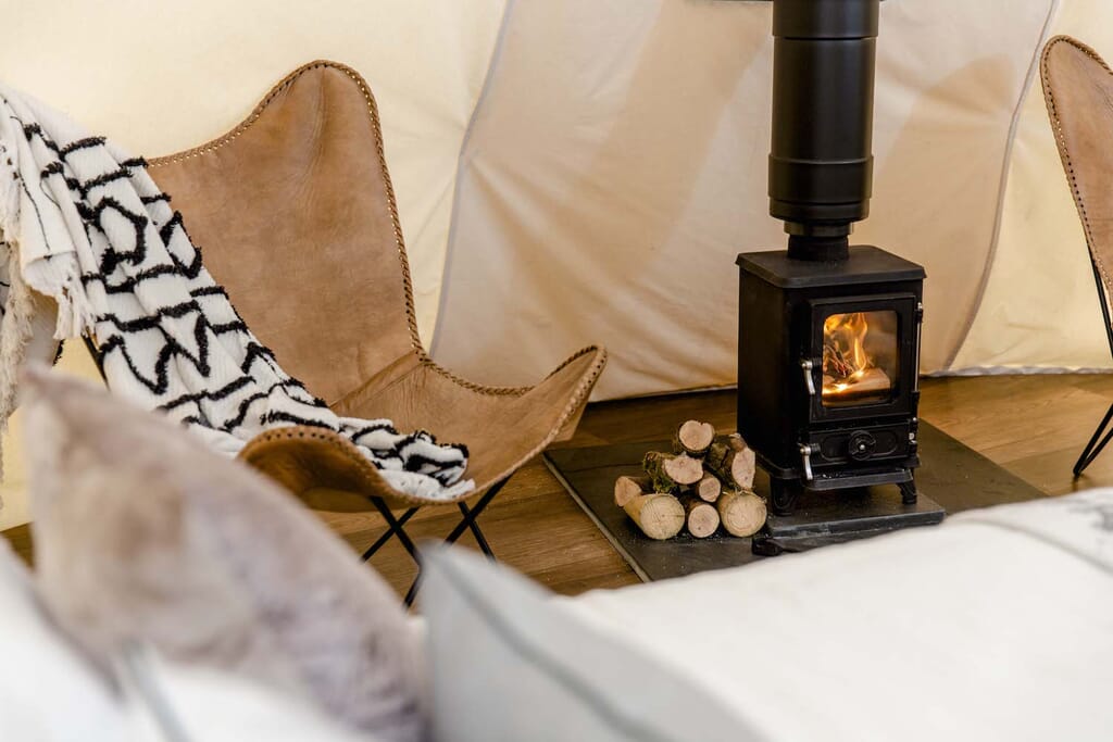 harta-retreat-luxury-glamping-woolacombe:e: tipi inside log burner