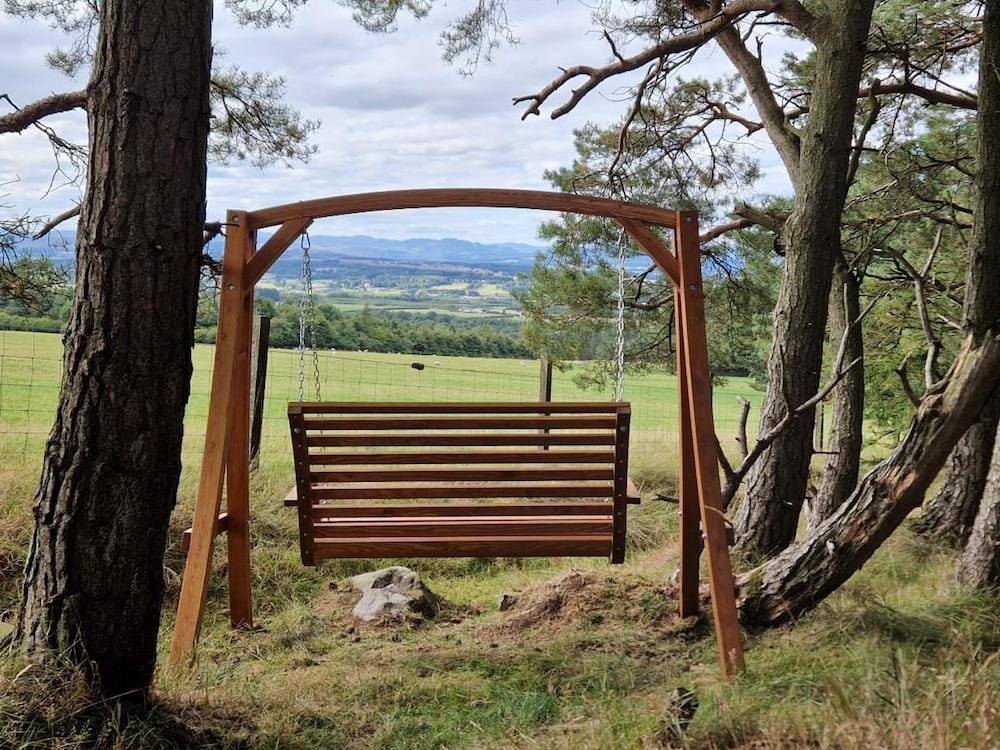 glamping in perthshire scotland - juniper lorry, swing seat at alexander house